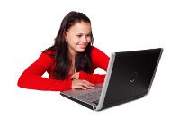 Photo: Woman using a laptop computer